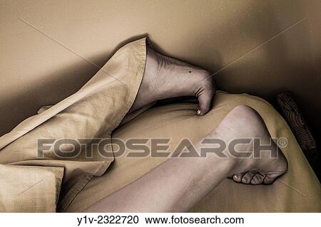 Stock Image - Young woman's legs and feet.. Fotosearch