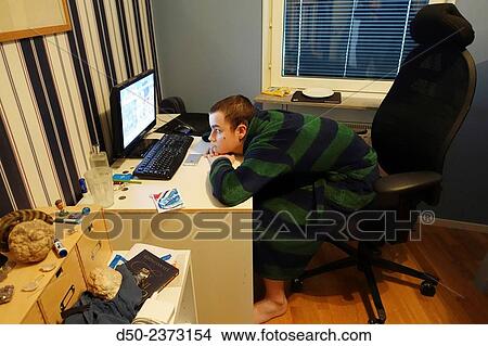 "14 year old in his room watching the computer. Stockholm, Sweden" View Large Photo Image Picture - "14 year old in his room watching the computer. Stockholm, Sweden". Fotosearch