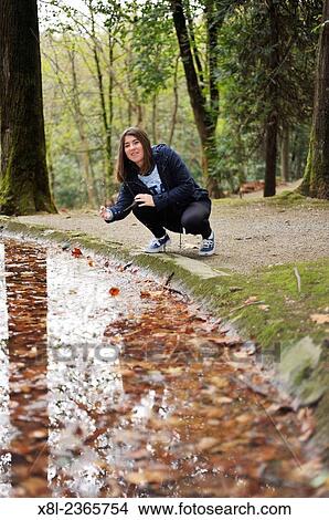 15 YEARS YOUNG GIRL PLAYING WITH WATER SPRINKLE View Large Photo Image Picture - 15 YEARS YOUNG GIRL PLAYING WITH WATER SPRINKLE. Fotosearch