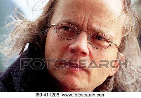 40 Year Old Man With Glasses And Long Hair Stock Photo L69