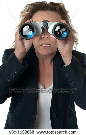"A businesswoman with binoculars seeing business chart and world map, concerned, shocked and outraged" View Large Photo Image Stock Photo - "A businesswoman with binoculars seeing business chart and world map, concerned, shocked and outraged". Fotosearch