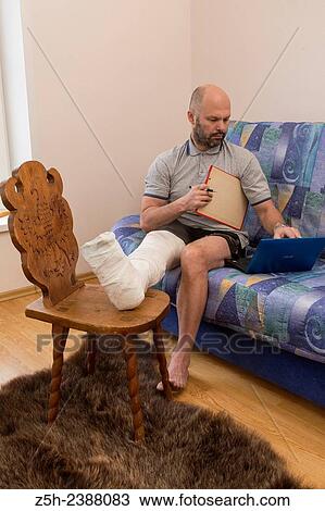 Stock Image - A man with a foot injury.. Fotosearch