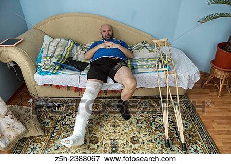 A man with a foot injury. View Large Photo Image Stock Photo - A man with a foot injury.. Fotosearch