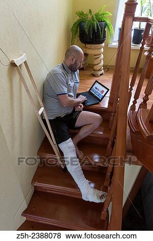 Stock Photo - A man with a foot injury.. Fotosearch
