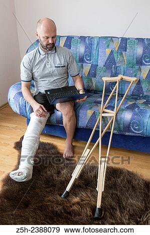 Stock Photo - A man with a foot injury.. Fotosearch