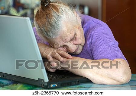 "An elderly woman, a lover of computer games. " View Large Photo Image Stock Image - "An elderly woman, a lover of computer games. ". Fotosearch