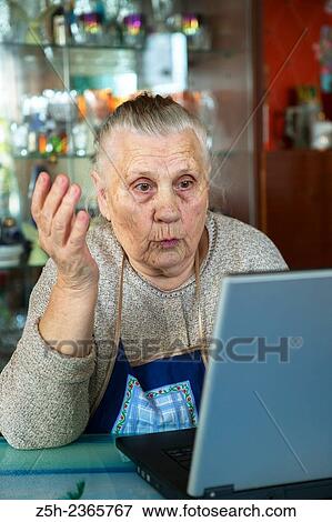 "An elderly woman, a lover of computer games. " View Large Photo Image Stock Photo - "An elderly woman, a lover of computer games. ". Fotosearch