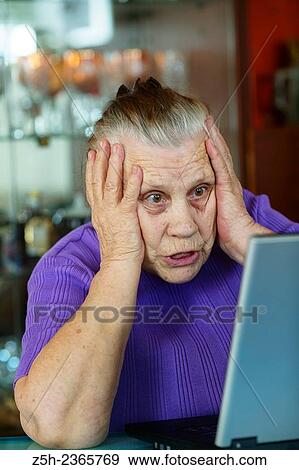 "An elderly woman, a lover of computer games. " View Large Photo Image Stock Photo - "An elderly woman, a lover of computer games. ". Fotosearch