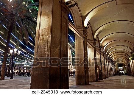 Stock Photo - "Arcades, Plaça Reial at night, Christmas lights, Barcelona, Catalonia, Spain". Fotosearch