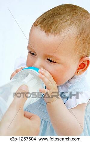 Picture - Baby eating. Fotosearch