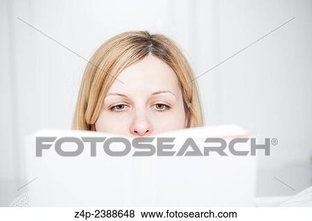 blond woman is reading a book. View Large Photo Image Stock Photo - blond woman is reading a book.. Fotosearch