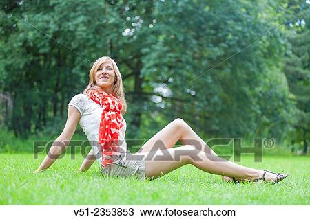 Blonde beautiful woman sittin in the park in Spring View Large Photo Image Stock Image - Blonde beautiful woman sittin in the park in Spring. Fotosearch