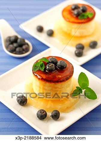Picture - Cheese tart with honey and blueberries.. Fotosearch