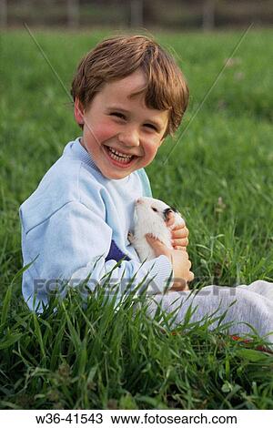 Child with guinea pig View Large Photo Image Stock Image - Child with guinea pig. Fotosearch