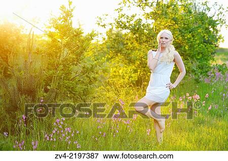 Close-up of a young woman at sunset. View Large Photo Image Stock Photo - Close-up of a young woman at sunset.. Fotosearch
