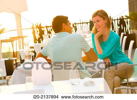 Couple in outdoor restaurant View Large Photo Image Picture - Couple in outdoor restaurant. Fotosearch