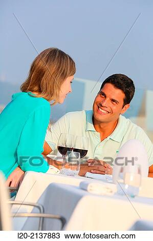 Couple in outdoor restaurant View Large Photo Image Stock Image - Couple in outdoor restaurant. Fotosearch