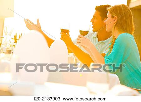 Couple in outdoor restaurant View Large Photo Image Stock Image - Couple in outdoor restaurant. Fotosearch