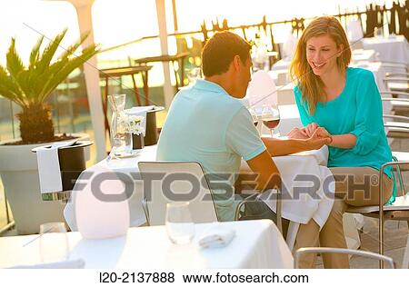 Couple in outdoor restaurant View Large Photo Image Stock Photo - Couple in outdoor restaurant. Fotosearch