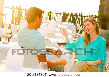 Couple in outdoor restaurant View Large Photo Image Stock Photo - Couple in outdoor restaurant. Fotosearch