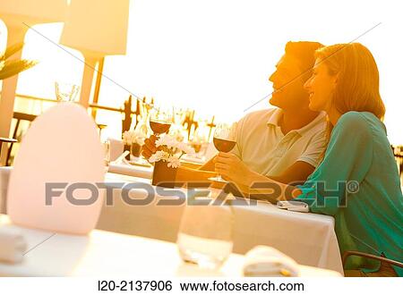 Couple in outdoor restaurant View Large Photo Image Stock Photograph - Couple in outdoor restaurant. Fotosearch