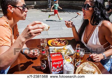 "Couple in Pulperia Melide eating ´Pulpo a feira´ octopus in Galician style, Plaza de España 16 or Plaza Campo de la Leña, Coruña city, Galicia, Spain. " View Large Photo Image Stock Photo - "Couple in Pulperia Melide eating ´Pulpo a feira´ octopus in Galician style, Plaza de España 16 or Plaza Campo de la Leña, Coruña city, Galicia, Spain. ". Fotosearch