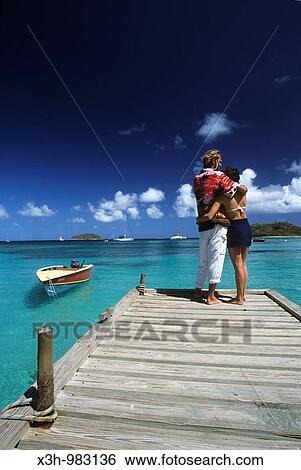"couple on a pontoon in Mayreau, Grenadines islands, Saint Vincent and the Grenadines, Winward Islands, Lesser Antilles, Caribbean Sea" View Large Photo Image Stock Photograph - "couple on a pontoon in Mayreau, Grenadines islands, Saint Vincent and the Grenadines, Winward Islands, Lesser Antilles, Caribbean Sea". Fotosearch