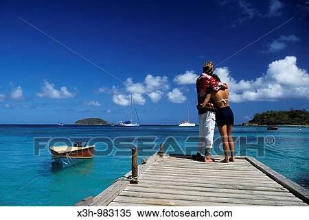 Stock Photography - "couple on a pontoon in Mayreau, Grenadines islands, Saint Vincent and the Grenadines, Winward Islands, Lesser Antilles, Caribbean Sea". Fotosearch