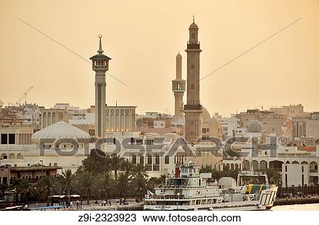 Stock Image - "Dubai Creek, view to the old Dubai and the bur Dubai Souk in the evening, United Arab Emirates. ". Fotosearch