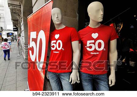 Dummies indicating discount in clothing store. Barcelona. Catalonia. Spain. View Large Photo Image Stock Image - Dummies indicating discount in clothing store. Barcelona. Catalonia. Spain.. Fotosearch