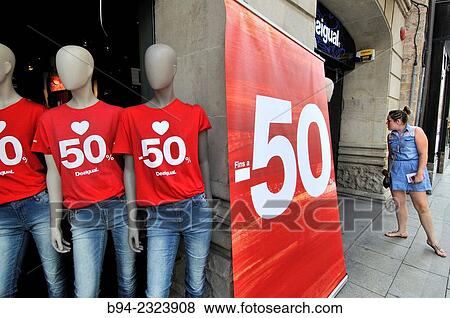Dummies indicating discount in clothing store. Barcelona. Catalonia. Spain. View Large Photo Image Stock Photo - Dummies indicating discount in clothing store. Barcelona. Catalonia. Spain.. Fotosearch