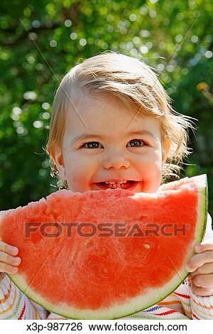 Eating watermelon View Large Photo Image Stock Photograph - Eating watermelon. Fotosearch