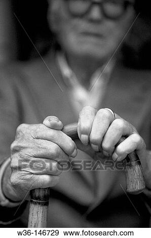 Elderly man with a walking stick View Large Photo Image Stock Photo - Elderly man with a walking stick. Fotosearch