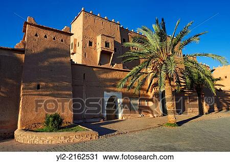Stock Image - "Exterior of the mud brick Kasbah of Taourirt, Ouarzazate, Morocco, built by Pasha Glaoui. A Unesco World Heritage Site. ". Fotosearch