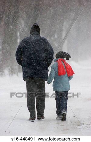 "Father and son walking through the blizzard - Ferentari neighborhood, Bucharest, Romania" View Large Photo Image Stock Image - "Father and son walking through the blizzard - Ferentari neighborhood, Bucharest, Romania". Fotosearch