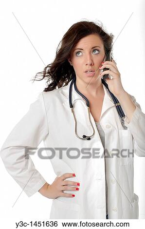 Female doctor talking on the phone View Large Photo Image Stock Photograph - Female doctor talking on the phone. Fotosearch