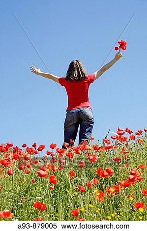 Stock Photography - Girl and poppies. Fotosearch