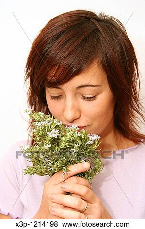 Girl smelling rosemary View Large Photo Image Stock Photo - Girl smelling rosemary. Fotosearch