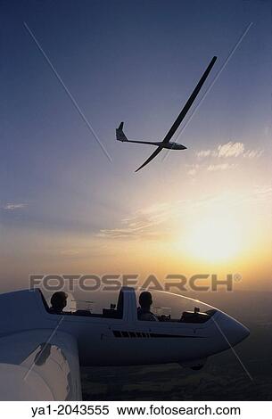 "Glider planes Twin Astir and ASH-25 flying on sunset near Santa Cilia de Jaca, Aragon, Spain. " View Large Photo Image Stock Photography - "Glider planes Twin Astir and ASH-25 flying on sunset near Santa Cilia de Jaca, Aragon, Spain. ". Fotosearch