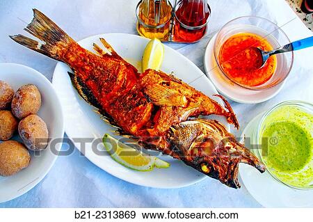 "Grilled ´cherne´ fish (grouper) with ´papas arrugadas´ (potatoes cooked in sea water) and red and green ´mojo´ sauces, Tenerife, Canary Islands, Spain" View Large Photo Image Stock Photo - "Grilled ´cherne´ fish (grouper) with ´papas arrugadas´ (potatoes cooked in sea water) and red and green ´mojo´ sauces, Tenerife, Canary Islands, Spain". Fotosearch