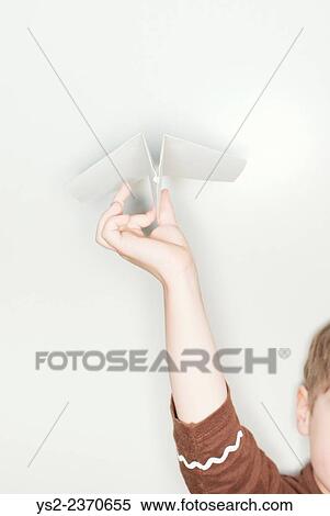 Stock Photography - Hand of child holding paper airplane.. Fotosearch