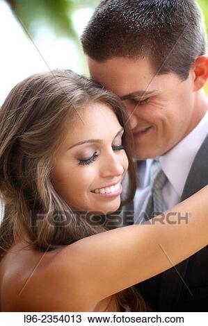 Stock Image - happy bride and groom in an intimate moment on their wedding day. Fotosearch