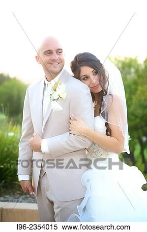 happy married couple embracing on their wedding day View Large Photo Image Stock Photography - happy married couple embracing on their wedding day. Fotosearch