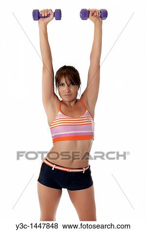 Hispanic fitness woman exercising with weights View Large Photo Image Stock Photo - Hispanic fitness woman exercising with weights. Fotosearch