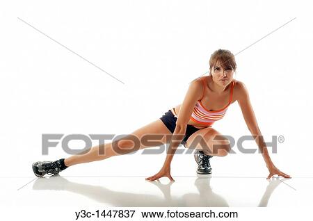 Hispanic fitness woman stretching View Large Photo Image Stock Photo - Hispanic fitness woman stretching. Fotosearch