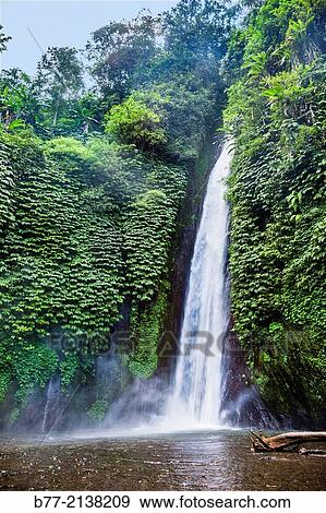 "Indonesia, Bali, Munduk Waterfall in the Banjar District of the Beleleng regency. " View Large Photo Image Stock Photo - "Indonesia, Bali, Munduk Waterfall in the Banjar District of the Beleleng regency. ". Fotosearch