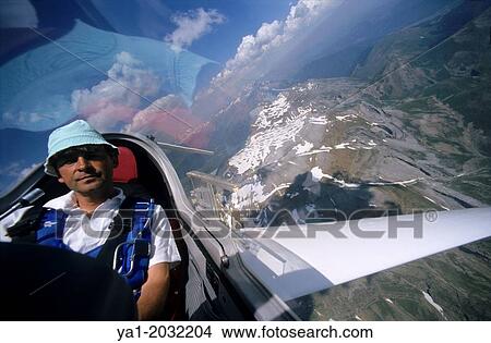 "Inside view of glider plane Twin Astir flying over Tendenera mountains, Aragon, Spain. " View Large Photo Image Picture - "Inside view of glider plane Twin Astir flying over Tendenera mountains, Aragon, Spain. ". Fotosearch