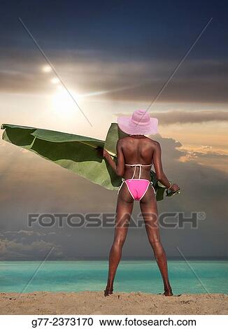 "Jamaican woman on the beach. Ocho Rios, Jamaica" View Large Photo Image Stock Image - "Jamaican woman on the beach. Ocho Rios, Jamaica". Fotosearch