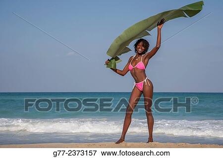 Stock Photo - "Jamaican woman on the beach, Ocho Rios, Jamaica". Fotosearch