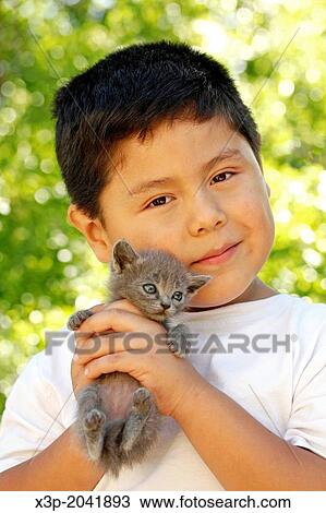 Stock Image - Kitten and kid.. Fotosearch